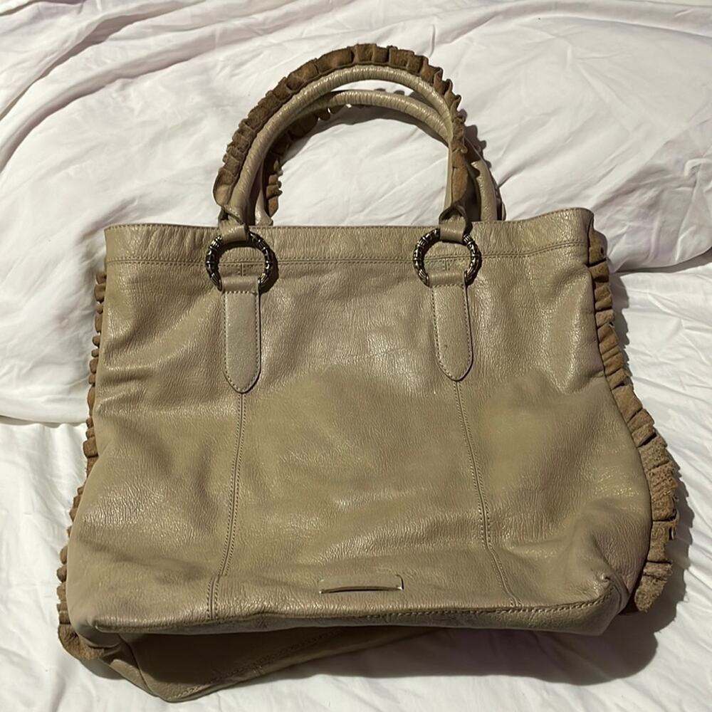 BCBGGirls tan leather handbag euc hand held ruffled handles brass rings w/charm